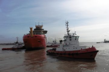 A small boat in a body of water.