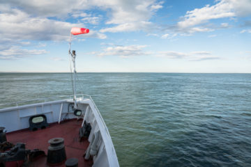 A boat on a body of water.
