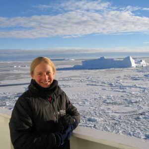 Joanne johnson that is standing in the snow.