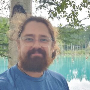 A man wearing sunglasses posing for the camera