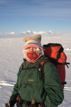 A man that is standing in the snow.