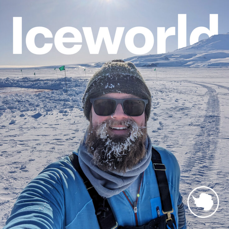 A man wearing a hat with snow on the ground