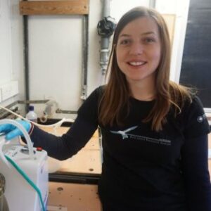 A woman standing in a kitchen.