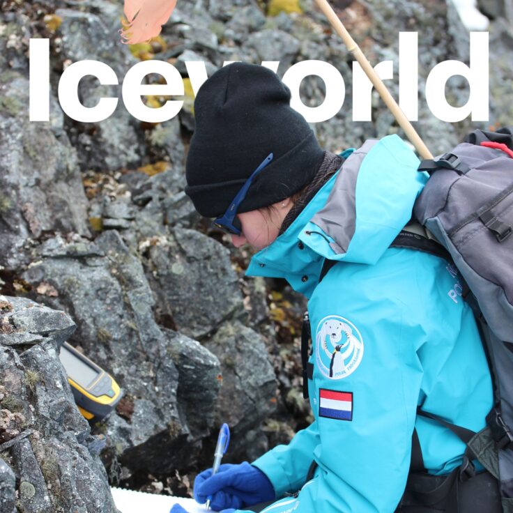 A person standing next to a pile of rocks