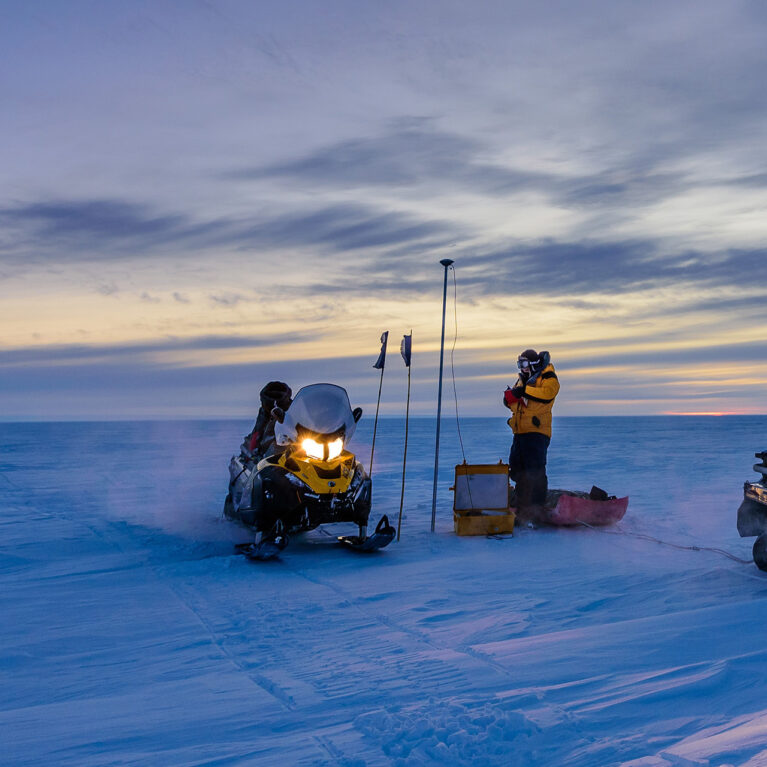 A pair of skidoos working in the deep Antarctic field.