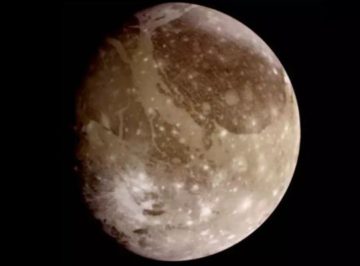 A close up of a half moon in the dark.