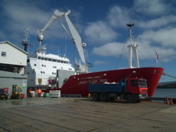 A large ship in the background.