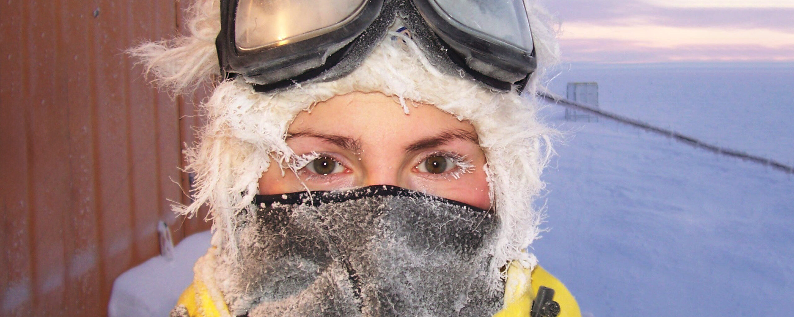 A person wearing a mask posing for the camera