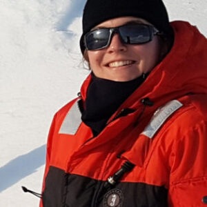 A man and a woman taking a selfie in the snow.