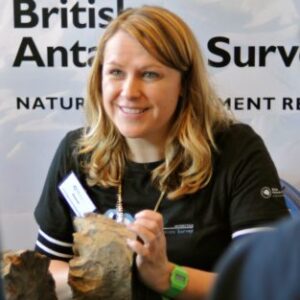 A woman holding a sign.