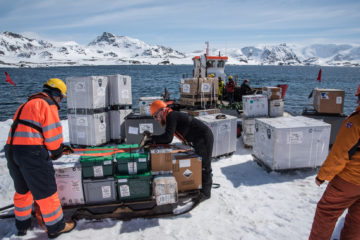 A group of people that are standing in the snow.