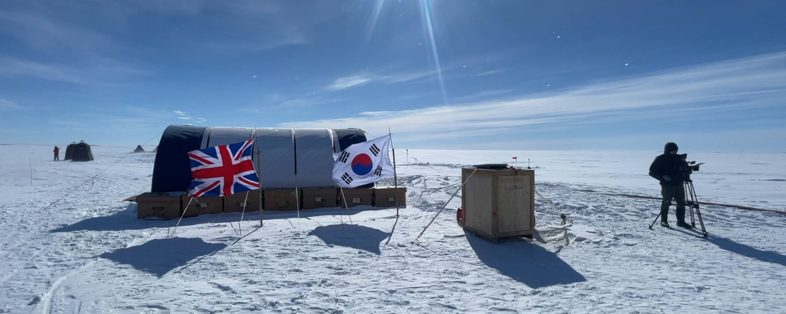A group of people flying kites in the snow