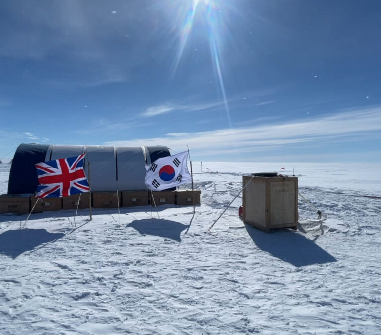 A group of people flying kites in the snow