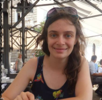 A woman sitting at a table.